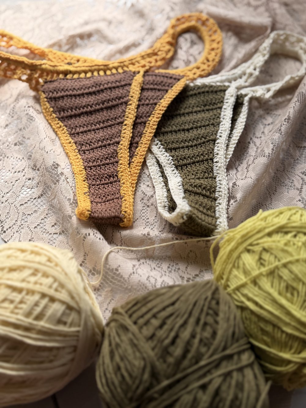 Handmade crochet pieces and yarn at Lualua